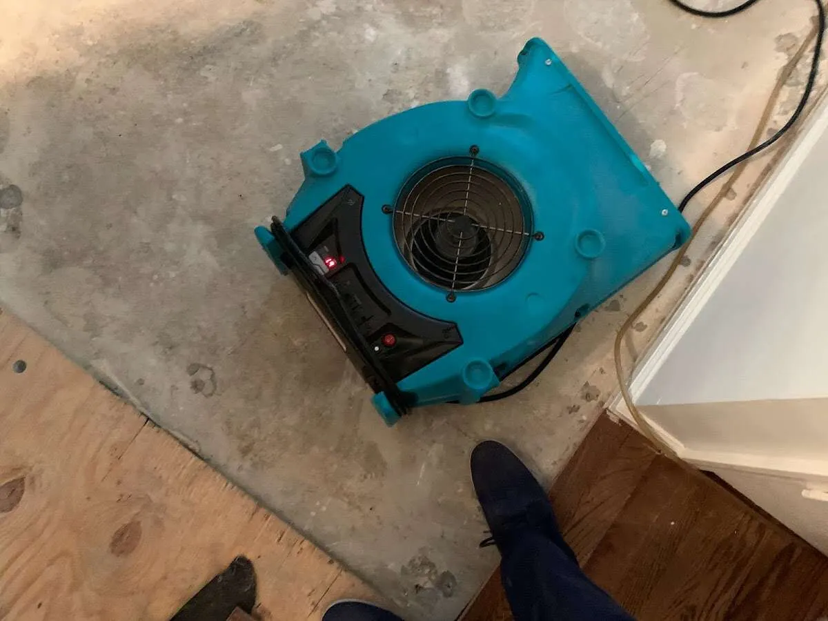 Air mover drying subfloor during Commercial Water Damage Restoration in Santee