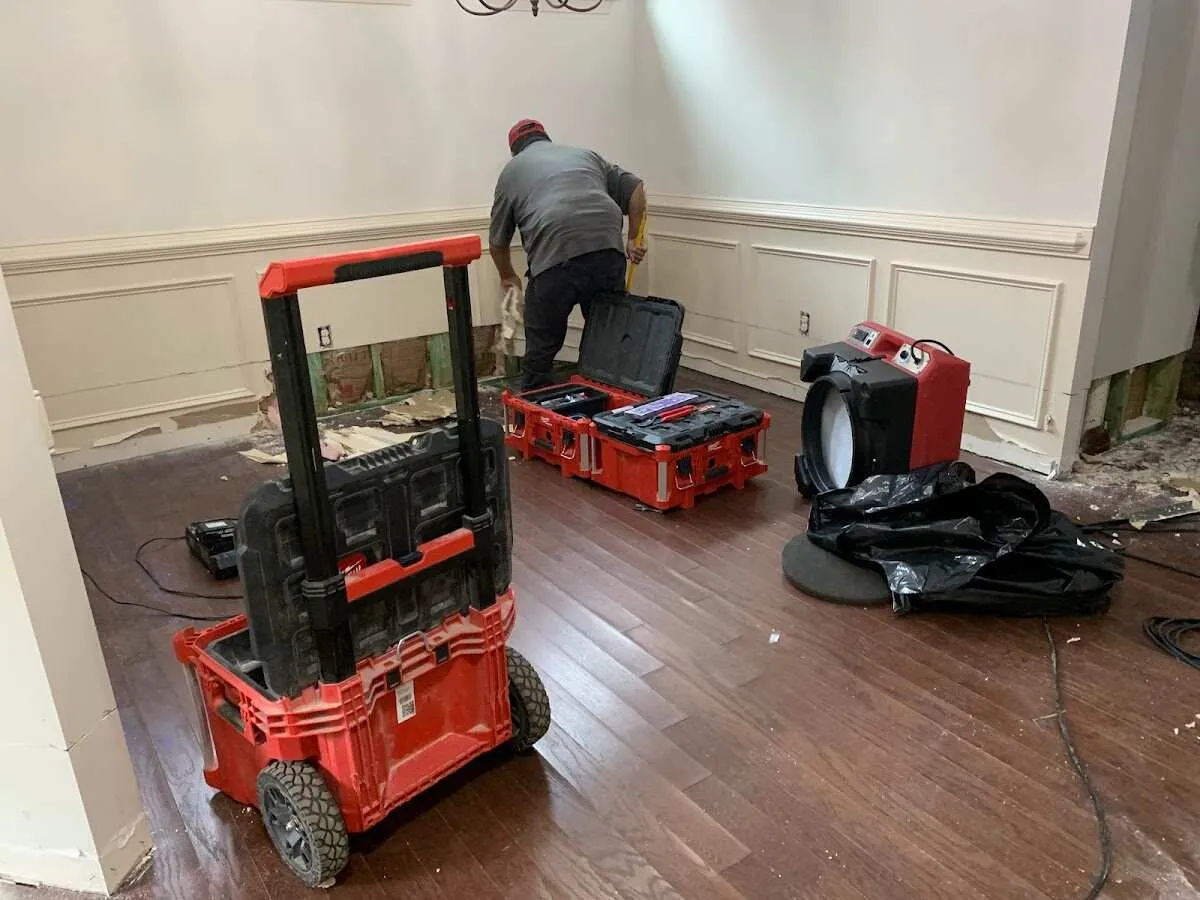 Technician setting up drying equipment for water damage in Santee